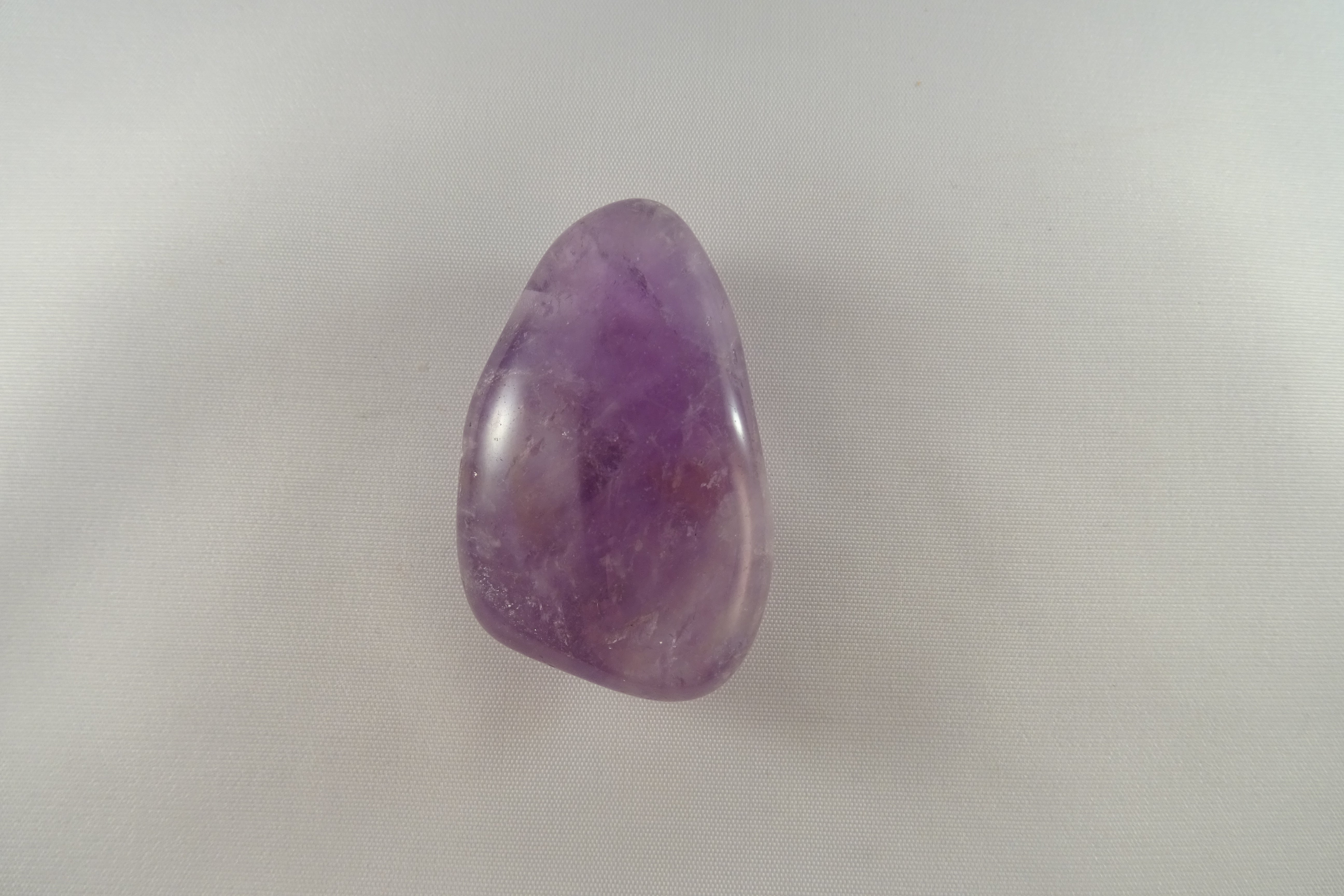 Amethyst - Trommelstein, gebohrt